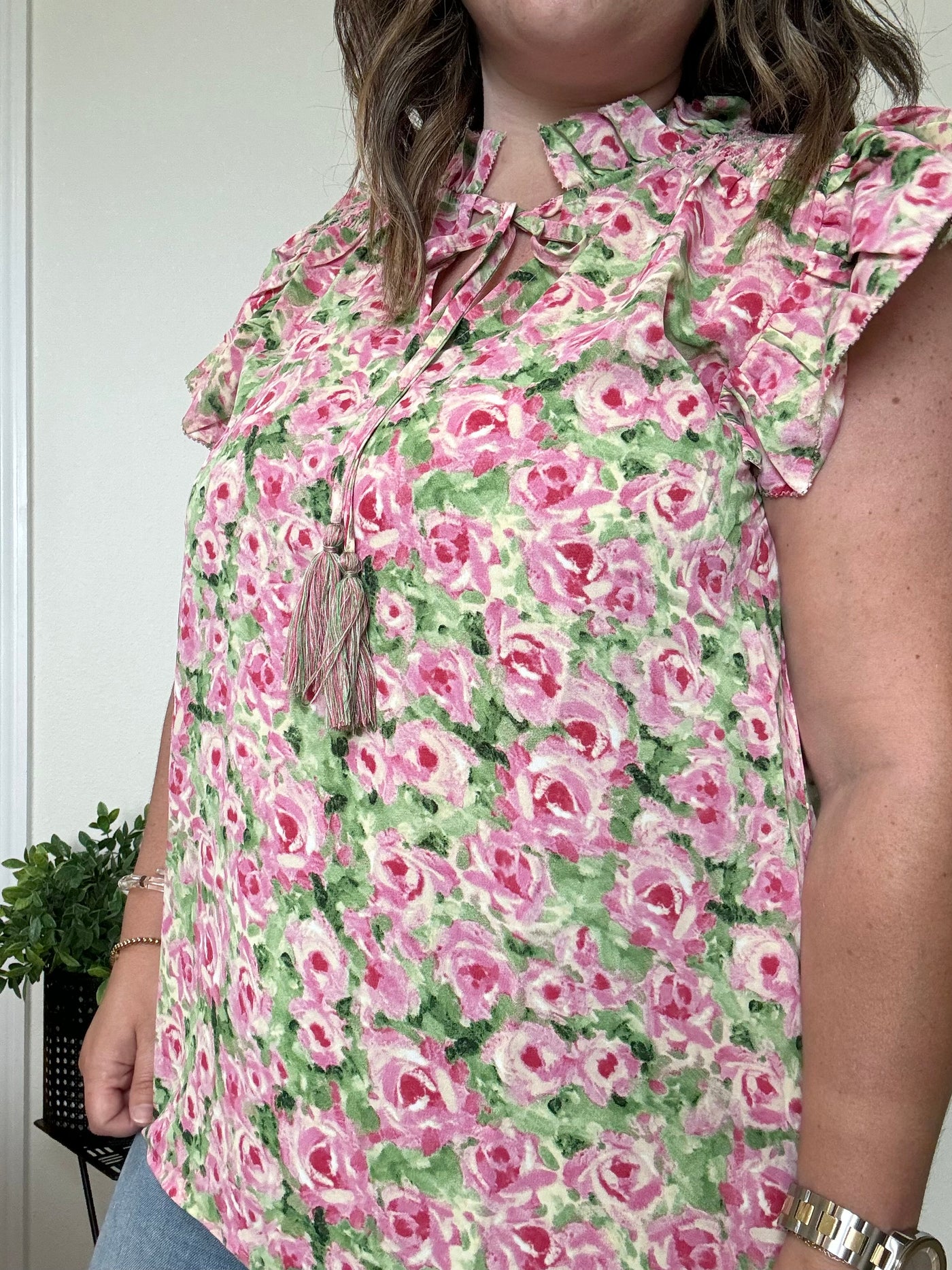 Floral blouse, green and pink with ruffle sleeves and tassel ties