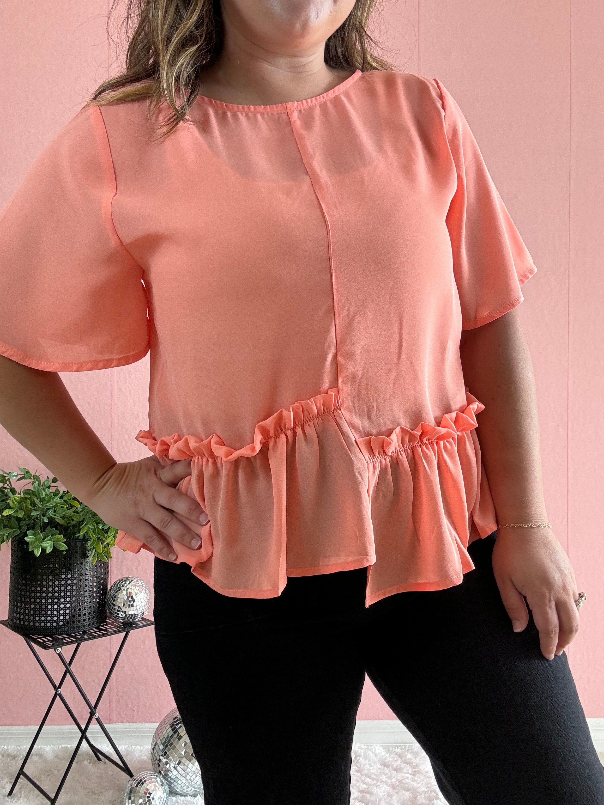 Orange ruffle detail top
