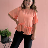 Orange blouse with ruffle detail