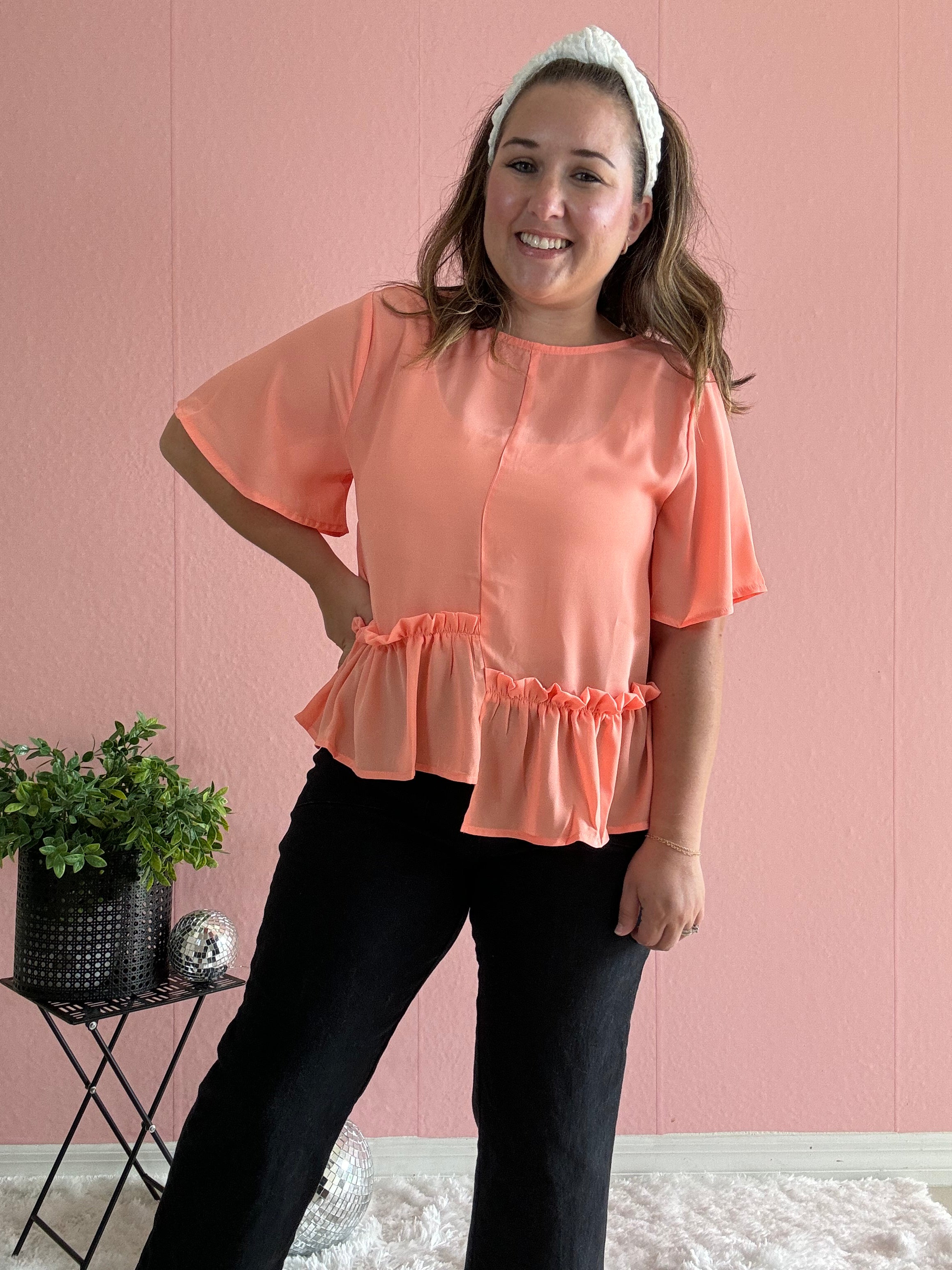Orange blouse with ruffle detail