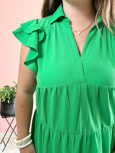 green midi dress with notched neckline