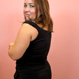 Woman wearing Black Off Shoulder Fitted Top