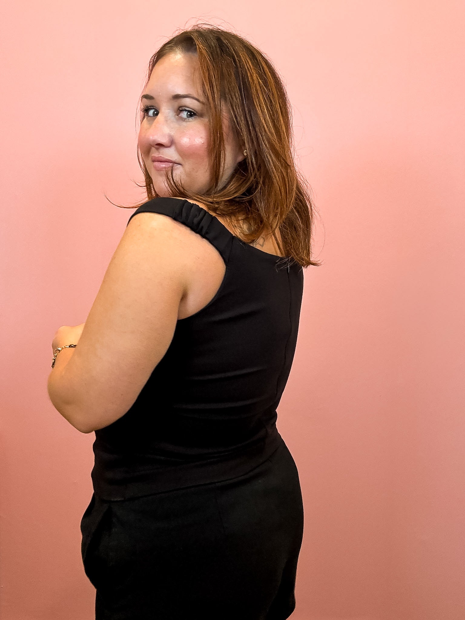 Woman wearing Black Off Shoulder Fitted Top