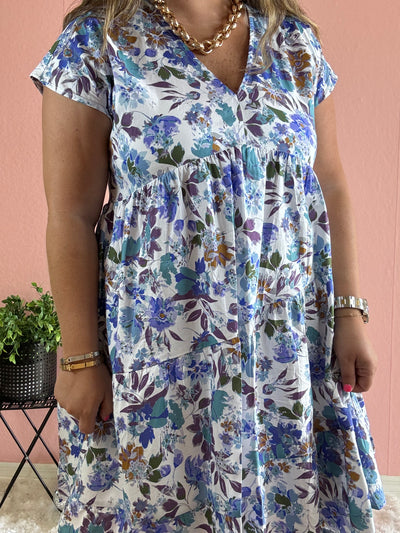 Blue floral details on white dress