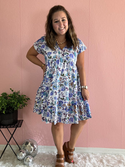 White dress with blue and brown floral pattern