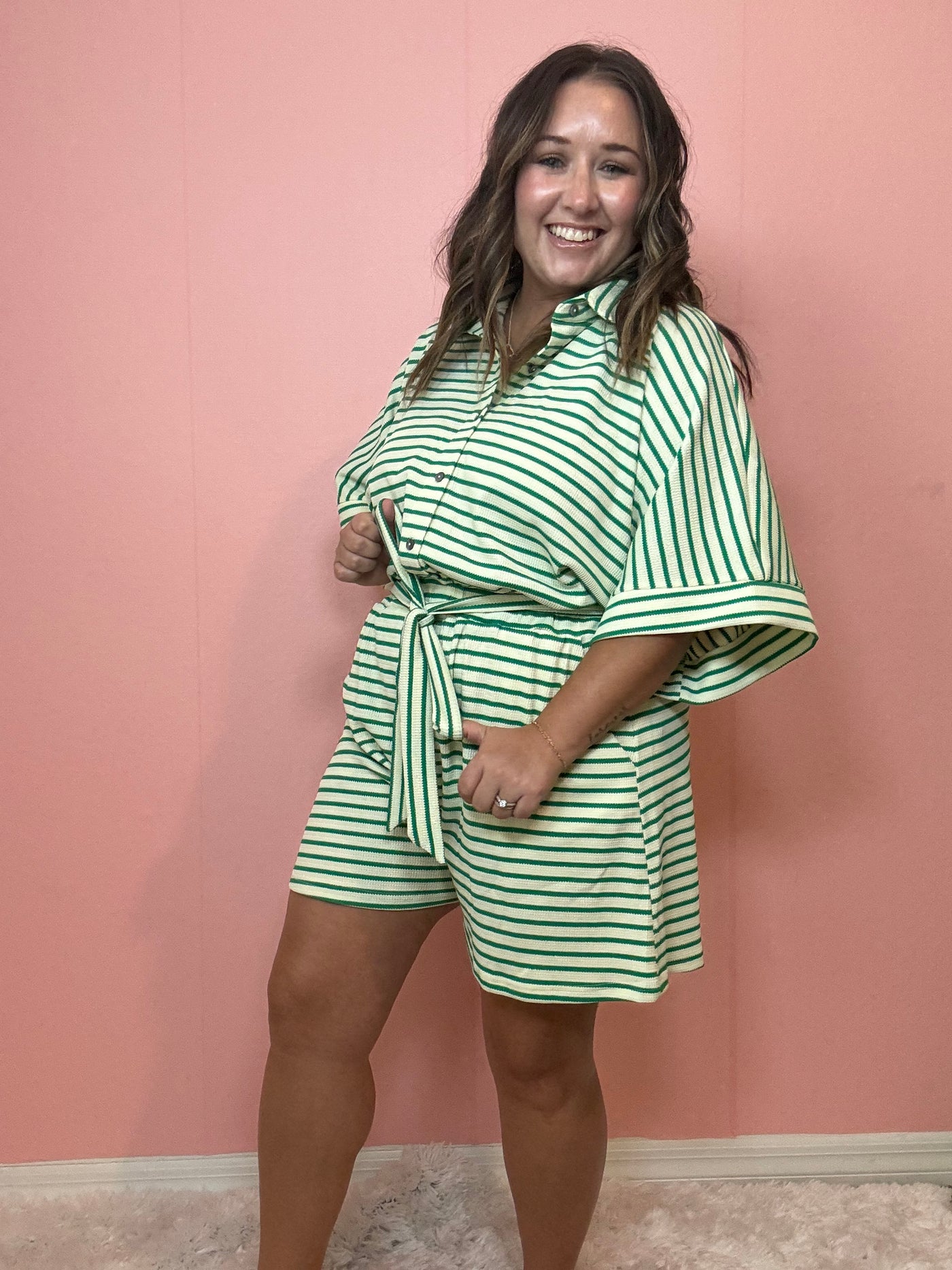 Green romper with stripes